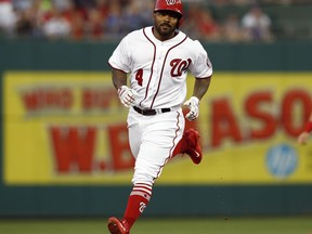 FILE - In this Aug. 15, 2017, file photo, Washington Nationals' Howie Kendrick rounds the bases after hitting a solo home run during the third inning of a baseball game against the Los Angeles Angels in Washington. The Nationals have agreed to a $7 million, two-year contract with Kendrick, a deal subject to a successful physical. Agent Pat Murphy confirmed the deal to The Associated Press on Monday, Jan. 15, 2018.
