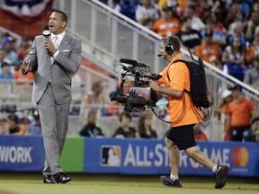 FILE - In this July 11, 2017, file photo, former MLB player Alex Rodriguez reports from the field during the MLB baseball All-Star Game, in Miami. Rodriguez once again is taking over for Aaron Boone in a high-profile spot, this time moving into the ESPN booth for Sunday Night Baseball. ESPN announced Tuesday, Jan. 23, 2018, that A-Rod was joining its crew as an analyst. The former star slugger will become a rare, two-network announcer _ he will continue as a studio analyst for Fox Sports in the postseason.  Rodriguez fills the ESPN spot held last season by Boone, hired last month to manage the New York Yankees. It will mark the second time Rodriguez has followed Boone.