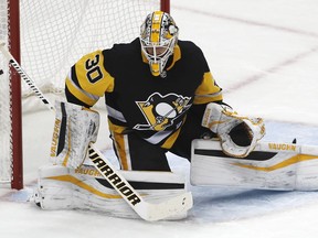 FILE - In this Thursday, Jan. 4, 2018, file photo, Pittsburgh Penguins goaltender Matt Murray blocks a shot during the first period of the team's NHL hockey game against the Carolina Hurricanes in Pittsburgh Murray is taking a leave of absence from the team following the death of his father, the Penguins announced Wednesday, Jan 17, 2018.  Murray's father Matt died on Tuesday in Ontario, Canada.