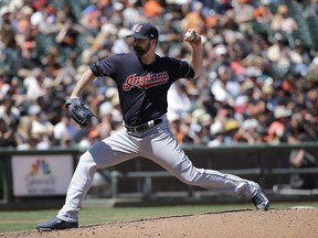FILE - In this July 19, 2017, file photo, Cleveland Indians pitcher Boone Logan throws against the San Francisco Giants during a baseball game in San Francisco. Reliever Boone Logan and the Milwaukee Brewers have finalized a $2.5 million, one-year contract. The 33-year-old left-hander was 1-0 with a 4.71 ERA in 38 games for Cleveland last year, striking out 28 in 21 innings.