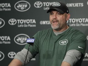 FILE - In this Tuesday, May 23, 2017 file photo, New York Jets offensive coordinator John Morton talks to reporters during the team's organized team activities at its NFL football training facility in Florham Park, N.J. A person with direct knowledge of the decision says the New York Jets have fired offensive coordinator John Morton after one season. The person spoke to The Associated Press on Wednesday, Jan. 17, 2018 on condition of anonymity because the team had not announced the move.