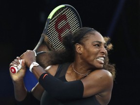 FILE - In this Jan. 28. 2017, file photo, United States' Serena Williams follows through on a backhand return to her sister Venus during the women's singles final at the Australian Open tennis tournament in Melbourne, Australia. The U.S. Tennis Association says Williams will return to competition for the first time in more than a year at the country's Fed Cup matches against the Netherlands next month. Williams has not played an official match since winning the Australian Open in January 2017 for her 23rd Grand Slam singles title. She was pregnant during that tournament and gave birth to a daughter on Sept. 1.