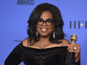 FILE - In this Jan. 7, 2018, file photo, Oprah Winfrey poses in the press room with the Cecil B. DeMille Award at the 75th annual Golden Globe Awards in Beverly Hills, Calif. Winfrey has visited the grave of a black Alabama woman whose rape by six white men in 1944 drew national attention and whose story was highlighted in Winfrey's recent Golden Globes speech. Winfrey said in an Instagram post that on assignment for "60 Minutes," she ended up in the town of Abbeville, Ala., where Recy Taylor suffered injustice, endured and recently died.
