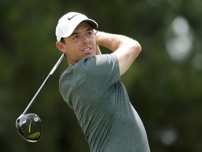 FILE - In this Aug. 12, 2017, file photo, Rory McIlroy watches his tee shot on the third hole during the third round of the PGA Championship golf tournament at the Quail Hollow Club in Charlotte, N.C. McIlroy says he has a heart ailment that will have to be monitored regularly but is not expected to affect his play. McIlroy said that he has a thickening of the left ventricle. He says doctors told him it was caused by a viral infection he suffered in China 18 months ago. He says he'll get an electrocardiogram every six months and an MRI once per year.