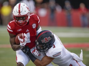 FILE - In this Sept. 2, 2017, file photo, Nebraska wide receiver Tyjon Lindsey (1) is tackled by Arkansas State defensive back B.J. Edmonds (3) during the first half of an NCAA college football game in Lincoln, Neb. Nebraska receiver Tyjon Lindsey and walk-on defensive lineman Dylan Owen were hospitalized after falling ill during winter conditioning drills, coach Scott Frost confirmed to two newspapers Tuesday, Jan. 30, 2018.