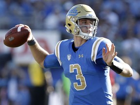 FILE - In this Sept. 9, 2017, file photo, UCLA quarterback Josh Rosen (3) passes the ball against Hawaii during the second half of an NCAA college football game in Pasadena, Calif. Quarterbacks Sam Darnold, Lamar Jackson and Josh Rosen are among the record 106 underclassmen given special entry to the NFL draft, making it four of the last five seasons in which at least 95 players have declared early. The NFL released Friday, Jan. 19, 2018, the official list of college players who have requested early entry.