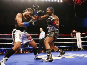 In a photo provided by Showtime, Claressa Shields throws a right at Tori Nelson during a boxing bout Friday night, Jan. 12, 2018, in Verona, N.Y. Shields scored a unanimous 10-round decision to retain her women's WBC and IBF super middleweight world titles.