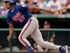 FILE - In this Sunday, Aug. 15, 1999 file photo, Montreal Expos' Vladimir Guerrero watches the flight of his two-run home run on a pitch from Colorado Rockies starting pitcher John Thomson in the sixth inning of a baseball game. Chipper Jones, Jim Thome, Vladimir Guerrero and Trevor Hoffman have been elected to the baseball Hall of Fame, Wednesday, Jan. 24, 2018.