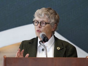 In this Oct. 20, 2017, photo, Michigan State University President Lou Anna Simon speaks during the dedication ceremony for the Gilbert Pavilion and Tom Izzo Hall of History inside Michigan State's Breslin Student Events Center in East Lansing, Mich. Simon submitted her resignation Wednesday, Jan. 24, 2018, amid an outcry over the school's handling of allegations against Larry Nassar.