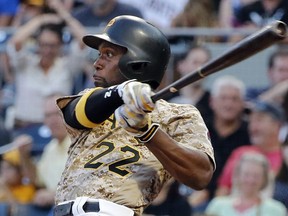 FILE - In this Aug. 3, 2017, file photo, Pittsburgh Pirates' Andrew McCutchen watches his RBI-single off Cincinnati Reds starting pitcher Sal Romano during the third inning of a baseball game in Pittsburgh. The Giants acquired McCutchen from the Pirates for right-hander Kyle Crick, minor league outfielder Bryan Reynolds and $500,000 in international signing bonus allocation.