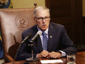 FILE - In this June 27, 2017, file photo, Gov. Jay Inslee talks to reporters about ongoing budget negotiations, in Olympia, Wash. As chairman of the Democratic Governors Association, Inslee will be working to elect governors from his party this year to counteract the Republican dominance in state legislatures. Governors in most states are key to the redistricting process that will follow the 2020 Census.