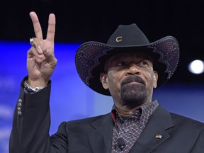 FILE - In this Feb. 23, 2017, file photo, Milwaukee County Sheriff David Clarke speaks at the Conservative Political Action Conference (CPAC) in Oxon Hill, Md. The former Milwaukee Sheriff's run-in with a man who shook his head at him while boarding a flight last year is headed for trial in federal court Monday, Jan. 22, 2018.