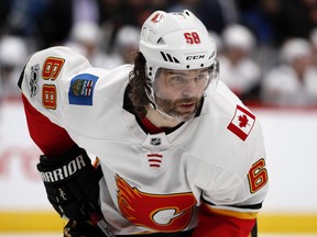 FILE - In this Nov. 25, 2017, file photo, Calgary Flames right wing Jaromir Jagr, of the Czech Republic, waits for a face-off against the Colorado Avalanche during the second period of an NHL hockey game in Denver. Multiple people with direct knowledge of the move say the Calgary Flames have placed Jagr on waivers. The people spoke to The Associated Press on condition of anonymity Sunday, Jan. 28, 2018, because the team had not announced the transaction.