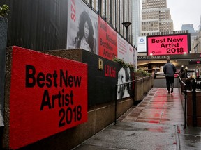 Signs posted around Madison Square Garden promote the return of the Grammy Awards to New York, Tuesday, Jan. 23, 2018, in New York. The Grammy Awards will be held on Sunday.