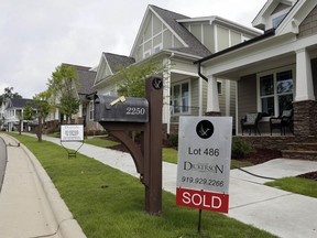 FILE - In this Tuesday, June 9, 2015, file photo, a "Sold" sign is displayed in the yard of a newly-constructed home in the Briar Chapel community in Chapel Hill, N.C. With just a few smart decisions, such as creating an emergency fund and getting an energy efficiency audit, you can get your homeownership off to a positive start.