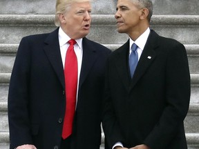 FILE - In this Friday, Jan. 20, 2017, file photo, President Donald Trump talks with former President Barack Obama on Capitol Hill in Washington, prior to Obama's departure to Andrews Air Force Base, Md. Trump relentlessly congratulates himself for the healthy state of the U.S. economy. But in the year since Trump's inauguration, most analysts tend to agree on this: The economy remains essentially the same sturdy one he inherited from Obama.