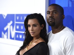 FILE - In this Aug. 28, 2016 file photo, Kim Kardashian West, left, and Kanye West arrive at the MTV Video Music Awards in New York. It's Chicago -- where Kanye West was raised -- as the name of baby No. 3 with Kim Kardashian West. Mom made the announcement Friday, Jan. 18, 2018, on her app without explanation. Chicago was born Monday, Jan. 15 weighing in at 7 pounds, 6 ounces. She joins big sister North and middle brother Saint.