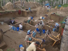 In this August 2013 photo provided by the University of Alaska, excavators work at the Upward Sun River discovery site in Alaska. According to a report released on Wednesday, Jan. 3, 2018, DNA from an infant who died in Alaska some 11,500 years ago, found at this site, is giving scientists the best look yet at the genetics of the ancestors of today's native peoples of the Americas.