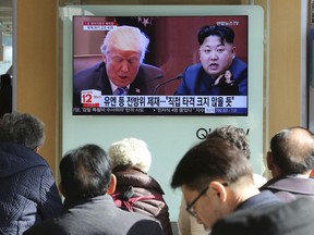 FILE- In this Nov. 21, 2017, file photo, people watch a TV screen showing images of U.S. President Donald Trump, left, and North Korean leader Kim Jong Un at Seoul Railway Station in Seoul, South Korea. With a sharp departure from years and sometimes decades of U.S. foreign policy, President Donald Trump has made a seismic global impact during his first year in office. Both North Korea and the U.S. traded threats and insults, and North Korea conducted an underground nuclear test and three ICBM launches that demonstrated at least a theoretical ability to reach the U.S.