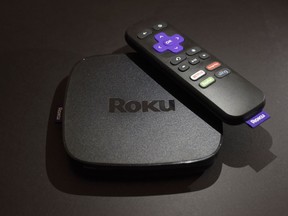 FILE - This Nov. 16, 2016 file photo shows the Roku Premiere streaming TV device in New York.  Roku plans to add a voice-controlled digital assistant to expanding lineup of online video players in an attempt to catch up with Google, Apple and Amazon. The internet-connected assistant will focus exclusively on fielding spoken request about video, music and other tasks tied to entertainment.