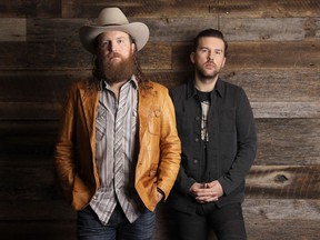 In this Jan. 9, 2018, photo, John, left, and T. J. Osborne, of the group Brothers Osborne, pose in Nashville, Tenn. Since releasing their debut album in 2016, the Maryland-born brothers TJ and John Osborne have been racking up the country music awards and high profile appearances, including the 60th annual Grammy Awards this Sunday.