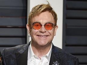FILE - In this Feb. 27, 2017 file photo, Elton John arrives at the Vanity Fair Oscar Party in Beverly Hills, Calif.  Elton John announced Wednesday, Jan. 24, 2018 that his upcoming tour will be his last.