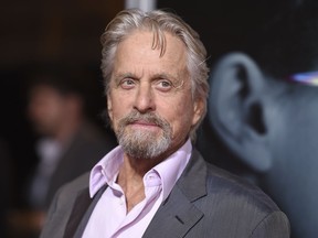 FILE - In this Sept. 27, 2017 file photo, Michael Douglas arrives at the world premiere of "Flatliners" in Los Angeles. Douglas has come forward to vigorously deny an allegation of sexual misconduct from three decades ago _ before even the publication of the claim. The two-time Oscar winner told Deadline that he anticipated an upcoming report would contain a claim by a former employee that he masturbated in front of her about 32 years ago.