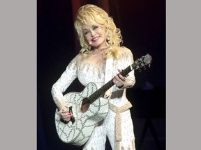 FILE - In this June 15, 2016 file photo, Dolly Parton performs in concert during her Pure & Simple Tour in Philadelphia. Parton has discarded "Dixie" from the name of a popular dinner show. From now on, the attraction will simply be known as Dolly Parton's Stampede.