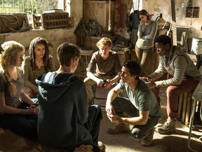 This image released by Twentieth Century Fox shows, from left, Katherine McNamara, Nathalie Emmanuel, Jacob Lofland, Thomas Brodie-Sangster, Dylan O'Brien, Rosa Salazar and Dexter Darden in a scene from "Maze Runner: The Death Cure."
