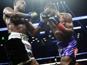Errol Spence Jr., left, punches Lamont Peterson during the fifth round of an IBF welterweight championship boxing match Saturday, Jan. 20, 2018, in New York. Spence stopped Peterson in the eighth round.