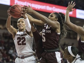 FILE - In this Dec. 31, 2017, file photo, South Carolina forward A'ja Wilson (22) grabs a rebound against Texas A&M forward Anriel Howard (5) during the second half of an NCAA college basketball game in Columbia, S.C. A panel of WNBA coaches and general managers put together mock selections for the first round of the league's draft that will take place in April. They were only allowed to choose seniors in their final season of eligibility and foreign players for the draft and couldn't make pick for their own teams.