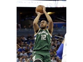 In this Jan. 20, 2017, photo, Milwaukee Bucks' Jabari Parker (12) takes a shot against the Orlando Magic during the first half of an NBA basketball game in Orlando, Fla. Bucks forward Parker is set to return to the court Friday, Feb. 2, 2018, against the New York Knicks, nearly a year after being sidelined with the second major left knee injury of his career.