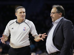 In this Feb. 21, 2016, photo, referee Monty McCutchen talks with Detroit Pistons head coach Stan Van Gundy during the first half of an NBA basketball game against the New Orleans Pelicans in Auburn Hills, Mich. McCutchen is now working in the league office and is tasked with trying to get referees and players to get along better.