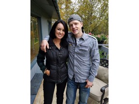 This Sept. 20, 2016, photo provide by Scott Smith shows Krista Smith, left, and her brother, Micah McComas in Chugiak, Alaska. An Alaska police officer has been cleared in last year's fatal shooting of McComas, a handcuffed suspect who had been placed in the officer's idling patrol car and managed to start driving it away.