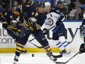 Buffalo Sabres forward Evander Kane (9) passes the puck during the first period of an NHL hockey game against the Winnipeg Jets, Tuesday, Jan. 9, 2018, in Buffalo, N.Y.