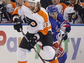 Philadelphia Flyers right wing Jakub Voracek (93) controls the puck against New York Rangers center Vinni Lettieri (95) during the first period of an NHL hockey game, Tuesday, Jan. 16, 2018, in New York.