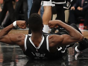 Brooklyn Nets guard Caris LeVert (22) reacts after scoring against the Orlando Magic during the fourth quarter of an NBA basketball game, Monday, Jan. 1, 2018, in New York. The Nets won 98-95.