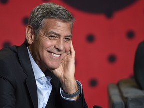 FILE- In this Sept. 10, 2017, file photo, George Clooney attends a press conference for "Suburbicon" on Day 4 of the Toronto International Film Festival in Toronto. Clooney is directing and starring in a TV series version of the novel "Catch-22." The streaming service Hulu said Sunday, Jan. 14, 2018, that the six-part series based on Joseph Heller's anti-war satire will go into production in 2018.