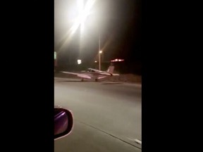 This image made from a video provided by Dora Noriega shows a plane that landed on a freeway south of Los Angeles on Sunday, Jan. 28, 2018. The Costa Mesa Fire Department tweeted Sunday night that the plane landed safely, its occupants got out and that no injuries were reported.