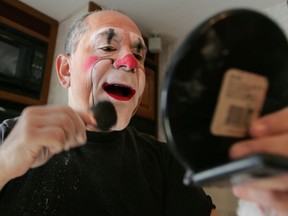 FILE- In this Dec. 1, 2005, file photo, Barry Lubin, star of the Big Apple Circus' "Grandma Goes to Hollywood," applies powder after applying his clown makeup in his trailer at Damrosch Park in New York's Lincoln Center. Lubin resigned from the Big Apple Circus following accusations that he pressured a 16-year-old aerialist to pose for pornographic photos. The circus's chairman, Neil Kahanovitz, told The New York Times on Tuesday, Jan. 23, 2018, that Lubin offered his resignation on Friday shortly after the alleged victim came forward.