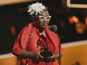 Cecile McLorin Salvant accepts the best jazz vocal album award for "Dreams And Daggers" at the 60th annual Grammy Awards at Madison Square Garden on Sunday, Jan. 28, 2018, in New York.