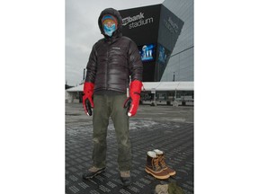 This Dec. 21, 2017 image shows Steve Schreader, who works at Midwest Mountaineering, an outdoor gear store in Minneapolis, modeling basic apparel for dressing in layers for winter, outside US Bank Stadium in Minneapolis. Schreader says layering is the key to staying warm and comfy in cold weather, whether you're attending a tailgate party in Minneapolis for Super Bowl or any other outdoor recreation.