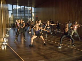 In this Aug. 16, 2017 photo, Nicole Winhoffer, front right, teaches her NWMethod fitness class at The Standard Hotel in New York. Loved by Madonna and Kate Hudson, Winhoffer mixes dance cardio and strength training. Her workout NW Church gives you access to the hour-long class Winhoffer teaches in New York every Sunday so you're sweating right alongside Nicole.