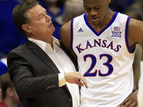 FILE - This Oct. 31, 2017 file photo shows Kansas head coach Bill Self, left, talking with Kansas forward Billy Preston (23) during the first half of an exhibition NCAA college basketball game against Pittsburg State in Lawrence, Kan. Preston has signed with a professional team in Bosnia, ending any chance the five-star prospect whose eligibility has been in question for months will play for the Jayhawks.
