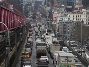 FILE - In this Jan. 11, 2018 file photo, traffic crosses the Williamsburg Bridge in New York from Brooklyn into Manhattan. Motorists would have to shell out $11.52 to drive into the busiest parts of Manhattan under a new proposal commissioned by Democratic Gov. Andrew Cuomo to ease traffic congestion and raise vital funds for mass transit. Trucks would pay even more, $25.34, while taxi cabs, Uber rides and for-hire vehicles would be charged between $2 and $5 per ride.