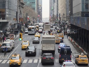 In this Thursday, Jan. 11, 2018 photo, traffic is seen making it's way across 42nd Street in New York. A proposal to make part Manhattan a toll zone, where drivers would be charged to drive into the most congested neighborhoods, is gaining momentum, despite continuing criticism from lawmakers representing car-heavy parts of Brooklyn and Queens.