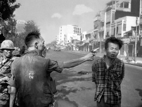 FILE - In this Feb. 1, 1968, file photo, South Vietnamese Gen. Nguyen Ngoc Loan, chief of the National Police, fires his pistol into the head of suspected Viet Cong officer Nguyen Van Lem (also known as Bay Lop) on a Saigon street, early in the Tet Offensive. The photo showed the war's brutality in a way Americans hadn't seen before. Protesters saw it as graphic evidence that the U.S. was fighting on the side of an unjust government.
