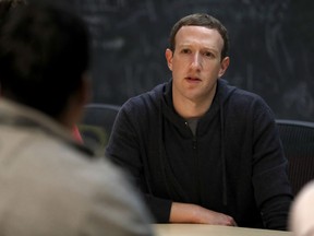File-This Nov. 9, 2017, file photo shows Facebook CEO Mark Zuckerberg meeting with a group of entrepreneurs and innovators during a round-table discussion at Cortex Innovation Community technology hub  in St. Louis. Facebook is announcing its second major tweak to its algorithm this month, saying it will prioritize news based on users' votes. The company said in a blog post and Facebook post from Zuckerberg Friday, jan. 19, 2018,  that it will survey users about how familiar they are with a news source and if they trust it.