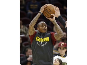 File- This Nov. 22, 2017, file photo shows Cleveland Cavaliers' Isaiah Thomas warming up for the team's NBA basketball game against the Brooklyn Nets in Cleveland.  Thomas will make his debut for Cleveland on Tuesday night against Portland after being sidelined with a hip injury. The All-Star has been out since last year's Eastern Conference finals with Boston. But after months of grueling rehab, Thomas will finally take the floor with Cleveland, which acquired him during the offseason in the blockbuster trade that sent Kyrie Irving to the Celtics. Thomas has building up his strength in recent weeks in scrimmages and has finally been cleared by Cleveland's medical and training staffs to play in a game.