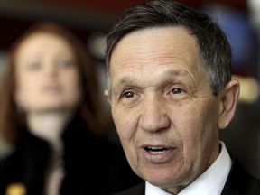 FILE- In this March 7, 2012, file photo, Dennis Kucinich speaks with reporters just before he boards a plane headed for Washington at the Hopkins International Airport in Cleveland. Former Cleveland mayor and U.S. Rep. Kucinich has filed paperwork indicating plans to join the race to become Ohio's next governor. The Democrat's filing Monday, Jan. 8, 2018, with the Ohio Secretary of State's office designated a treasurer for the Kucinich for Ohio campaign.